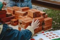 Eco friendly and zero waste wooden toy blocks. Activity for kids, play and creativity concept. Child playing with Wooden Building