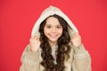 Eco fur concept. Sheepskin coat fashion trend. Cold weather. Winter fashion. Small girl long curly hair. Child comfy