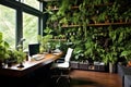 Eco home office with table, comfortable armchair and laptop. Background from leaves and plants. Plant wall with lush green colors Royalty Free Stock Photo