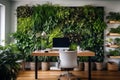 Eco home office with table, comfortable armchair and laptop. Background from leaves and plants. Plant wall with lush green colors Royalty Free Stock Photo