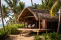 Eco house or eco bungalow with cozy veranda and sunbeds, surrounded by palm trees, overlooking the ocean, ecotourism