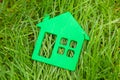 Eco house in nature. Symbol of house on grass in summer