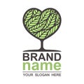 Tree heart logo with green beautiful leaves inside. Royalty Free Stock Photo
