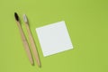 Eco living concept. Bamboo toothbrushes on a green background top view