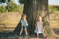 Eco living. Happy children farmers having fun on spring field. Children farmer in the farm with countryside background Royalty Free Stock Photo