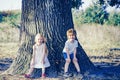 Eco living. Happy children farmers having fun on spring field. Children farmer in the farm with countryside background Royalty Free Stock Photo