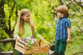 Eco living. Happy children farmers having fun on spring field. Children farmer in the farm with countryside background Royalty Free Stock Photo