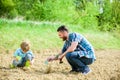 Eco living. happy earth day. Family tree. father and son planting flowers in ground. new life. soils fertilizers. rich Royalty Free Stock Photo