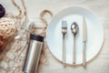 Eco Living and Packaging Reusable Products Concept, Empty Containers and Household on The Table With Fork, Spoon, Knife, Dish, Bag