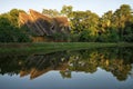 Eco lodge reflectin into the water in Ecuador Royalty Free Stock Photo