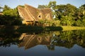 Eco lodge reflecting in water in Ecuador