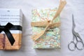 Eco firendly recycled packaging with gifts packed in used paper and newspapers to combat the planet pollution in the world