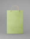 Eco packaging mockup bag kraft paper with handle front side. Standart medium green template on gray background promotional
