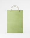 Eco packaging mockup bag kraft paper with handle front side. Standart medium green template on white background promotional