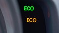 ECO pictogram sign at car dashboard. Ecological drive mode in automobile.
