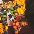 device in hand measuring nitrates and pesticides on market vegetables and fruits Royalty Free Stock Photo