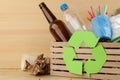 Eco symbol and trash in the box. recycling. waste recycling. on natural wooden background Royalty Free Stock Photo