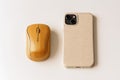 Eco tech accessories mockup with bamboo mouse and recycled phone case on clean white background Royalty Free Stock Photo