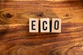 ` ECO ` text made of wooden cube on  wooden background Royalty Free Stock Photo