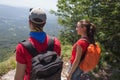 Eco tourism and healthy lifestyle concept. Young hiker girl end boy with backpack Royalty Free Stock Photo