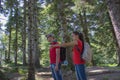 Eco tourism and healthy lifestyle concept. Young hiker girl end boy with backpack Royalty Free Stock Photo