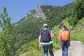 Eco tourism and healthy lifestyle concept. Young hiker girl end boy with backpack. Active hikers Royalty Free Stock Photo