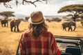 Woman tourist on a safari in Africa, traveling by car with an open roof. AI Generated