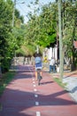 Eco view pedestrian / cycle lane, with cyclist pedaling Royalty Free Stock Photo