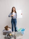 Eco-Volunteer Woman With Blank Placard Standing Among Containers With Different Sorted Waste