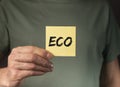 ECO word on paper in male hands, natural and organic life concept