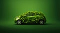 Ecofriendly transport concept. Leaves covered car. Ecology concept on green background