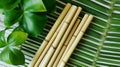 Ecological bamboo cocktail tubes for lemonades and drinks. Concept: Safe eco-friendly tableware without harm to the planet.