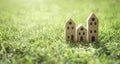 Ecological cardboard model house in empty field at sunset Royalty Free Stock Photo