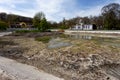 Ecological catastrophy. Drying lake in city park. Dry swamp lake disappears, idea and concept of environmental conservation,