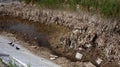 Ecological catastrophy. Drying lake in city park. Dry swamp lake disappears, idea and concept of environmental conservation,