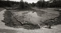 Ecological catastrophy. Drying lake in city park. Dry swamp lake disappears, idea and concept of environmental conservation,