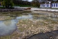 Ecological catastrophy. Drying lake in city park. Dry swamp lake disappears, idea and concept of environmental conservation, Royalty Free Stock Photo