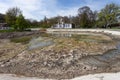 Ecological catastrophy. Drying lake in city park. Dry swamp lake disappears, idea and concept of environmental conservation,