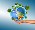 Ecological concept of the environment with the cultivation of trees on the ground in the hands. Planet Earth. Physical Royalty Free Stock Photo