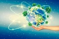 Ecological concept of the environment with the cultivation of trees on the ground in the hands. Planet Earth. Physical Royalty Free Stock Photo