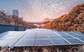 Ecological energy renewable solar panel plant with urban landscape landmarks Royalty Free Stock Photo