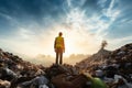 Ecological engineer confronts a mountain of degraded waste and garbage Royalty Free Stock Photo