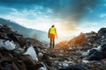 Ecological engineer confronts a mountain of degraded waste and garbage Royalty Free Stock Photo