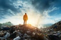 Ecological engineer confronts a mountain of degraded waste and garbage Royalty Free Stock Photo