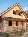 Ecological family house construction. Lining the house of spruce boards. Royalty Free Stock Photo