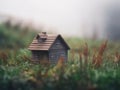 Ecological green wood model house in empty field Royalty Free Stock Photo