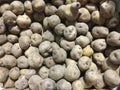 Aerial view of organic potatoes in bulk. Raw Sweet potato pile display at fresh market stall. Background of fresh and raw potatoes Royalty Free Stock Photo