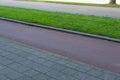 Ecological infrastructure. Sidewalk next to bicycle lane next to green strip and car road