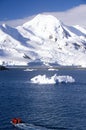 Ecological tourists in inflatable Zodiac boat and glaciers and icebergs near Half Moon Island, Bransfield Strait, Antarctica