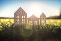 Ecological wood  model house in empty field at sunset Royalty Free Stock Photo